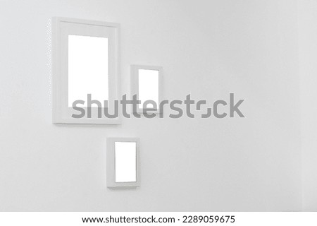white picture frame in white wall
