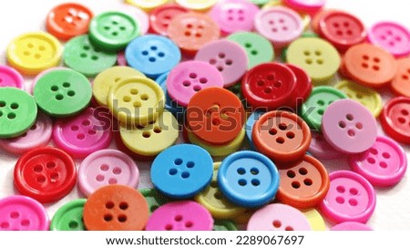shirt buttons for diy handmade. colorful buttons. collection of various sewing buttons on white background Royalty-Free Stock Photo #2289067697