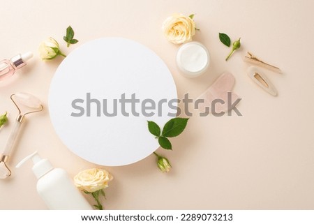 Capture attention with this stunning skin care top view flat lay featuring serum bottles, rose petals, and an empty circle for branding on a pastel beige backdrop Royalty-Free Stock Photo #2289073213