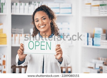 Open, business sign and woman portrait in a pharmacy with billboard from medical work. Working, pharmacist and healthcare worker with a smile from retail store opening and small business poster