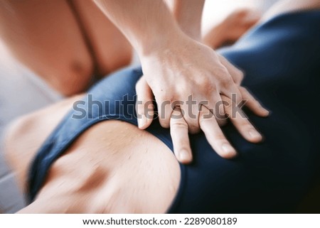 Hands, cpr and chest compression for swimming emergency, drown or accident with lifeguard. Sports, breathing and resuscitation of woman, rescue of athlete or saving life of swimmer in top view. Royalty-Free Stock Photo #2289080189
