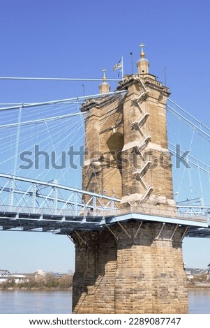 Bridge towers with American flag on top and staircases on side of towers on a bright early Spring Day in the heartland of America! Urban city photography USA.