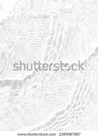 Defocus blurred transparent white colored clear calm water surface texture with splashes and bubbles. Trendy abstract nature background. Water waves in sunlight with copy space. White water shine Royalty-Free Stock Photo #2289087887