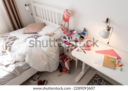 mess after the game in the girl's room. scattered toys Royalty-Free Stock Photo #2289093607