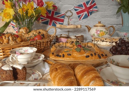 King Charles and Camilla's Coronation Vintage Street Tea Party with royal crown baked  bread  Royalty-Free Stock Photo #2289117569