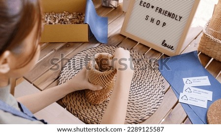 Eco vendor go green packaging parcel carton box in net zero waste store asian seller retail shop. Earth care day small SME owner asia people wrap reuse brown paper pack gift reduce plastic free order. Royalty-Free Stock Photo #2289125587