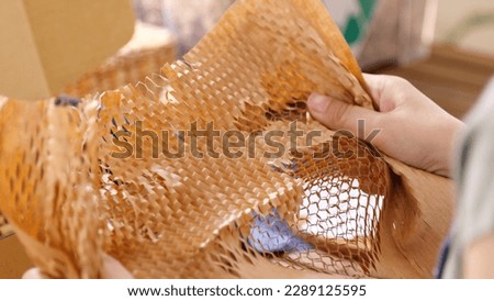 Eco vendor go green packaging parcel carton box in net zero waste store asian seller retail shop. Earth care day small SME owner asia people wrap reuse brown paper pack gift reduce plastic free order. Royalty-Free Stock Photo #2289125595