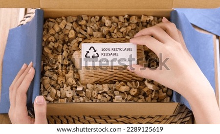 Eco vendor go green packaging parcel carton box in net zero waste store asian seller retail shop. Earth care day small SME owner asia people wrap reuse brown paper pack gift reduce plastic free order. Royalty-Free Stock Photo #2289125619