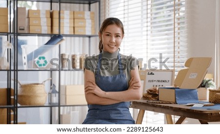 Go green use eco friendly packaging box in net zero waste store asian seller retail home office shop. Small SME owner young adult asia Gen Z people happy relax smile pride arm cross looking at camera. Royalty-Free Stock Photo #2289125643