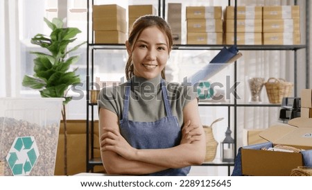 Go green use eco friendly packaging box in net zero waste store asian seller retail home office shop. Small SME owner young adult asia Gen Z people happy relax smile pride arm cross looking at camera. Royalty-Free Stock Photo #2289125645