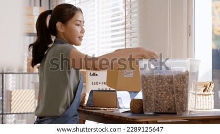 Eco vendor go green packaging parcel carton box in net zero waste store asian seller retail shop. Earth care day small SME owner asia people wrap reuse brown paper pack gift reduce plastic free order. Royalty-Free Stock Photo #2289125647