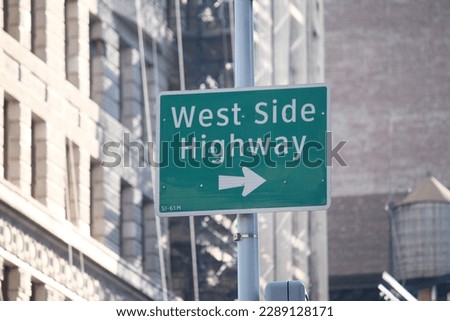 Green West Side Highway direction traffic sign in Manhattan