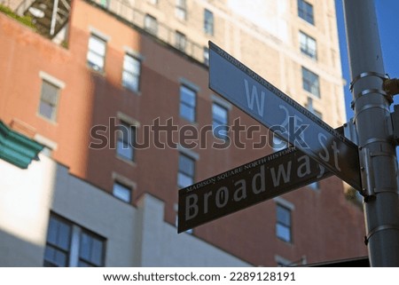 Brown West 25th Street and Broadway historic sign in Midtown Manhattan in New York City