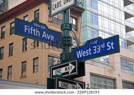 Blue West 33rd Street and Fifth Avenue historic sign in midtown Manhattan in New York