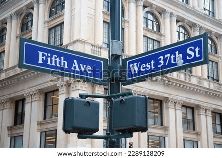 Blue West 37th Street and Fifth Avenue historic sign in midtown Manhattan in New York