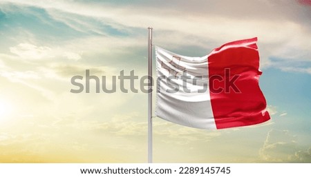 Waving flag of Malta in beautiful sky. Malta flag for independence day. Royalty-Free Stock Photo #2289145745