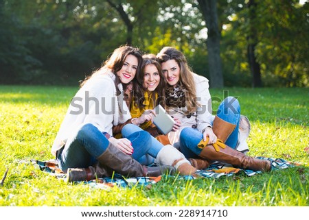 Three beautiful young women in the park