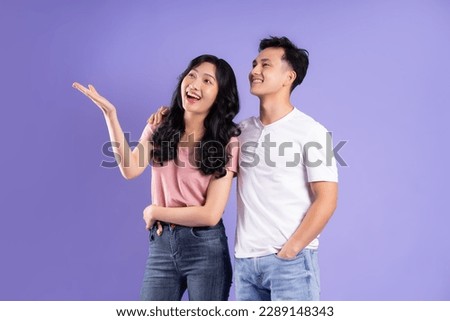 image of asian couple posing on purple background