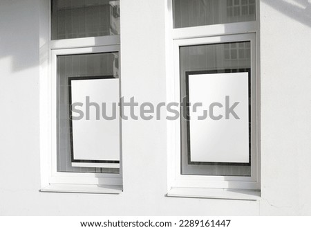 white rectangle logo on wall with windows ,poster for mockup design