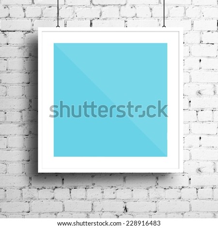 Poster mockup template with white square frame on brick wall