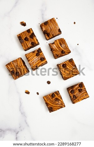Peanut butter brownies on a white marble background
