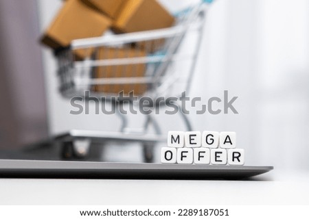Payment methods words on cubes with a toy shopping cart and cardboard boxes in the background. Online shopping concept. 