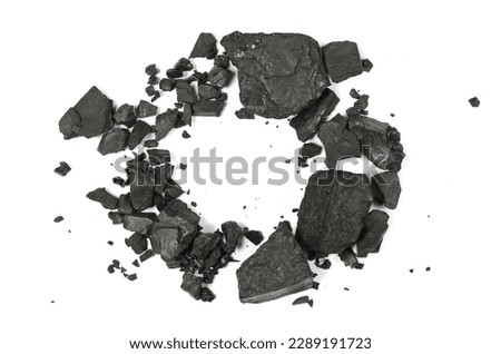 Black coal frame, fragments in shape circle isolated on white background and texture, top view