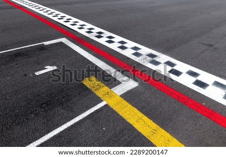 Pole position number one sign on asphalt race track, arrival first win start concept, motor sports symbols Royalty-Free Stock Photo #2289200147