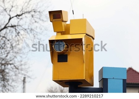 04.10.2023 wroclaw, poland, The yellow speed camera takes pictures of traffic violations for car drivers.