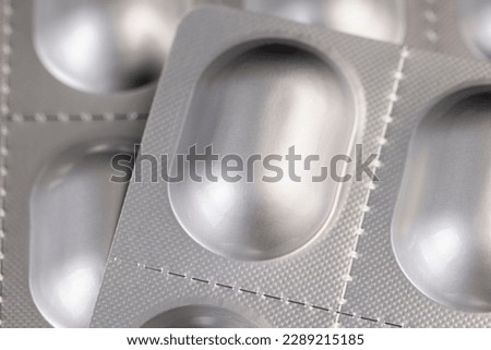 aluminum blister with medicines, close-up of aluminum foil packaging for medicines Royalty-Free Stock Photo #2289215185