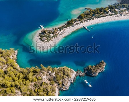 Aerial drone photo of Ölüdeniz, Fethiye, Turkey, showcasing the turquoise waters, picturesque coastline, and beautiful beaches of this popular summer destination. Royalty-Free Stock Photo #2289219685
