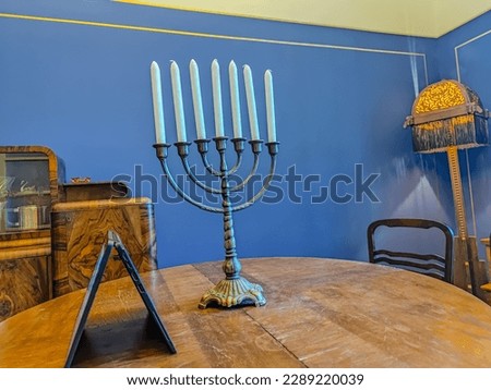 Religion image of jewish holiday Hanukkah background with menorah and candles in art deco style interior