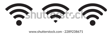 Collection of stock vector images depicting symbols and icons related to wireless Wi-Fi connectivity, including Wi-Fi signal symbols and an internet connection, that enable remote internet access. Royalty-Free Stock Photo #2289238671