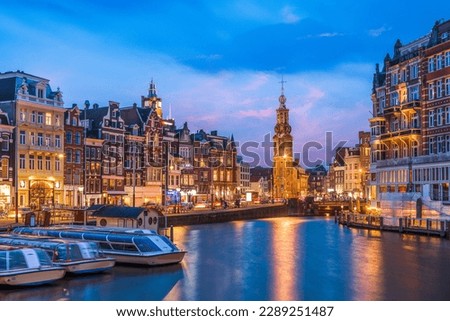 Amsterdam, Netherlands cityscape on the canals at twilight with Munttoren Tower. Royalty-Free Stock Photo #2289251487