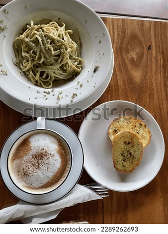 cheese spaghetti on toast and a glass of hot cocoa