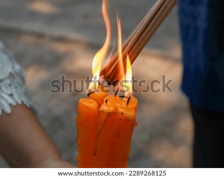candles, incense, paying homage to monks, religion