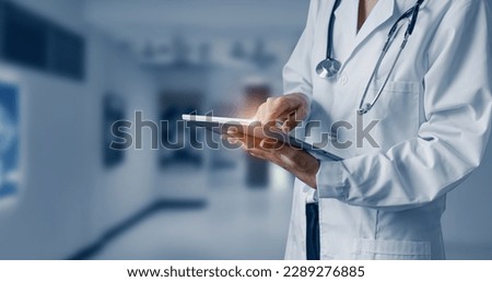 Medicine doctor hands touching on digital tablet. Medical technology and futuristic concept. Royalty-Free Stock Photo #2289276885