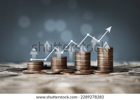 stacks of coins and graphs finance concept stock business investment Royalty-Free Stock Photo #2289278283