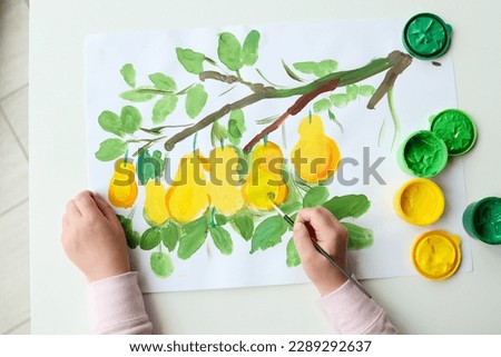 Children's drawing with paints, lemons on a tree.
