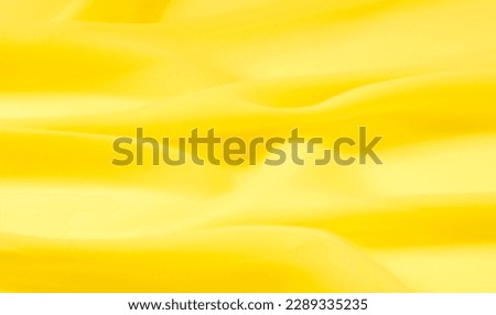 background seamless texture - yellow silk. Premium silk organza in pale yellow is an exceptional fabric, beautiful both on its own and as an accessory in terms of highlighting.