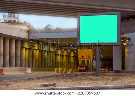 Billboard with green background, Mock up. The scene under the concrete structure of the road bridge