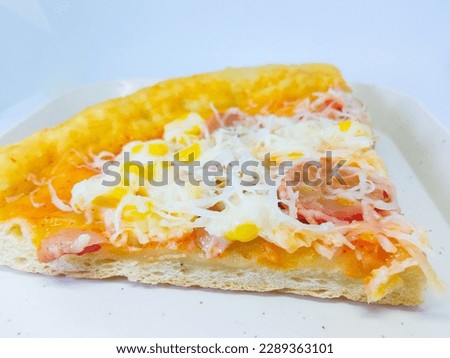 pizza with cheese, sausage, corn, and sauce toppings on a close up view
