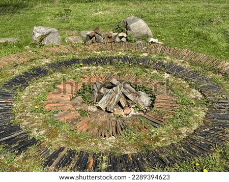 Ground fire pit. Recreation area with a hearth in the meadow 