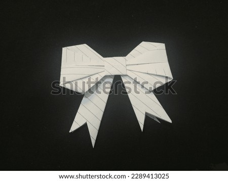 "Elegant Origami Ribbon: A Delicate Touch of Artistry"