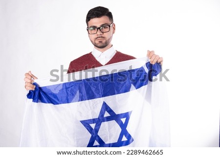 Young attractive man with the Israeli flag. Happy man. 