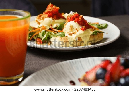 Toast with Egg, Cheese and Vegetables - juice in the foreground