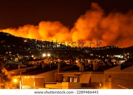 Forest Fire at Night.Wildfire burning forest trees in the mountain.Wildfires caused by humans. Penteli. Greece. Royalty-Free Stock Photo #2289486441