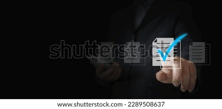 Maximize Your Business Potential: The Power of Accurate Reviews and Proven Checks. A Businessman's Hand Selects the Perfect Document with a Correct 'Tick' Mark, Unleashing the Key to Success Royalty-Free Stock Photo #2289508637