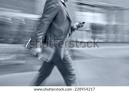 abstract image of business people in the street and modern style with a blurred background and blue tonality