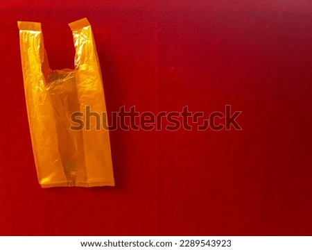 Trash plastic bag on the red screen background suitable for image article, photography journalism, website image